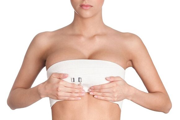 Bandage after breast enlargement surgery